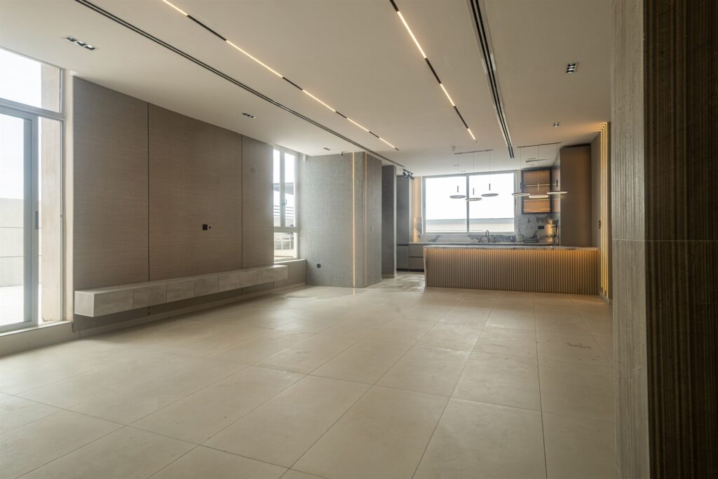 Brum Height 6: Open-plan living area adjoining an island kitchen